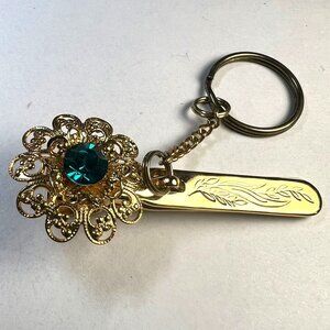 Vtg Kings Key Finder Clip Filigree Flower Teal Gem, LA, Ca. Gold-tone Etching